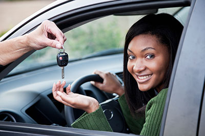 Girl with car keys and car